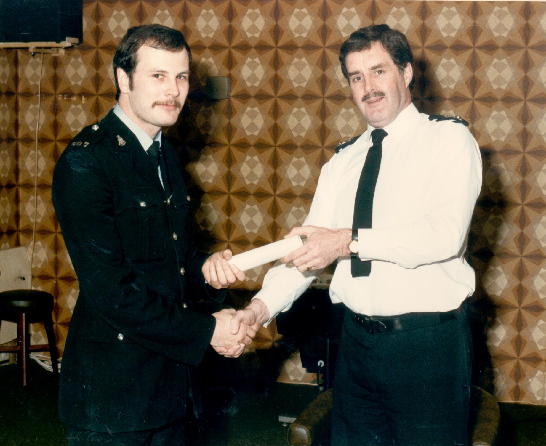  Chief Superintendent Joe Skipsey presenting Police Constable Paul Menhinick with his award for bravery. 1986. (Gloucestershire Police Archives URN 475)