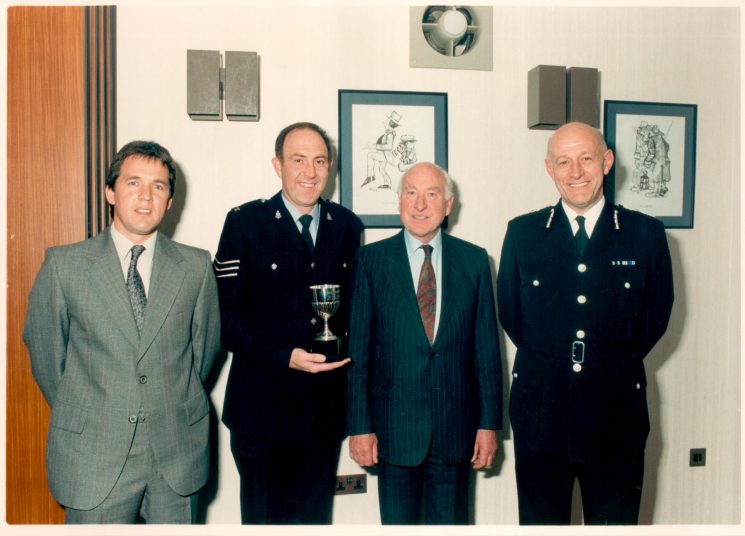 Colburn Trophy 1990, Detective Constable Nick Dawkins ( runner - up) Police Sergeant Paul Boak (winner) Mr Oscar Colburn  Commander British Empire; Justice of the Peace; Deputy Lieutenant , Chief Constable Pacey. (Gloucestershire Police Archives URN 518) 