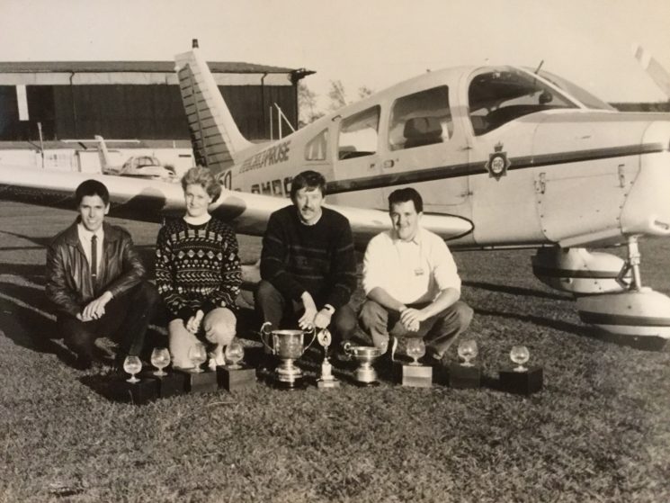 The Gloucestershire team had  just returned from the Police National Air Rally at Leeds Bradford Airport on 10th May 1996. From the left. Steve Drew, Alayne McGarry (Waterhouse), Terry Dwight and Chris Carver. They had won the Navigation Competition, Precision Flying, Spot Landing and Best Overall Crew. (Gloucestershire Police Archives URN 7949)  | Photograph from Terry Dwight