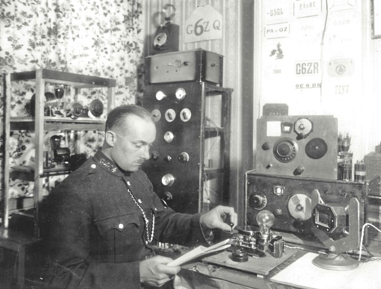 Police Constable 414 John Squire sending Morse code message. Thought to be 1930s. (Gloucestershire Police Archives URN 11226)